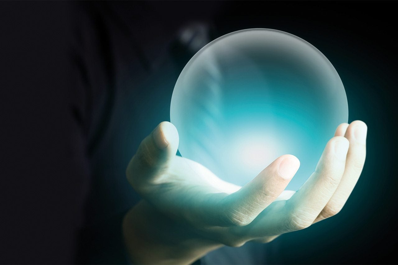 A crystal ball in a hand